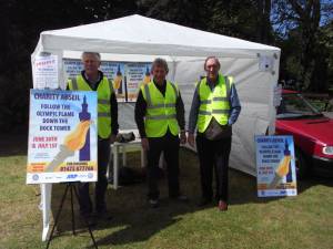 Rotarians outside the tent,advertising the Dock Tower abseil.